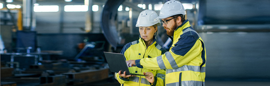 Construction worker, helmets, laptop Ahlsell